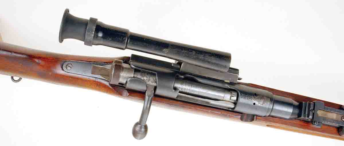 This photo of a Type 97 sniper rifle shows how the scope is offset from the action, and the oblong bolt knob is also evident.